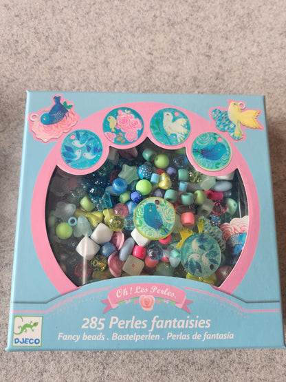 Contas de fantasia de pássáros, flores e lacinhos